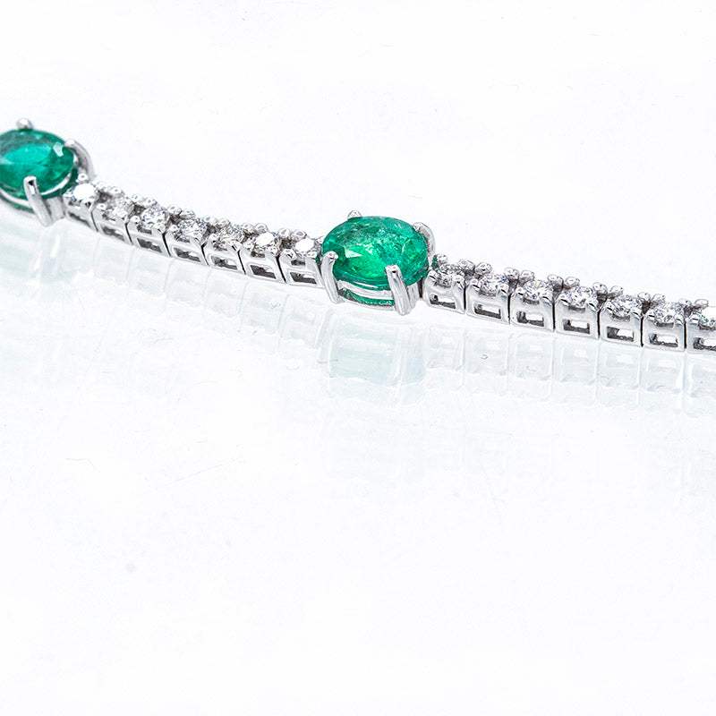 Riviere Bracelet with oval Emeralds and Diamonds